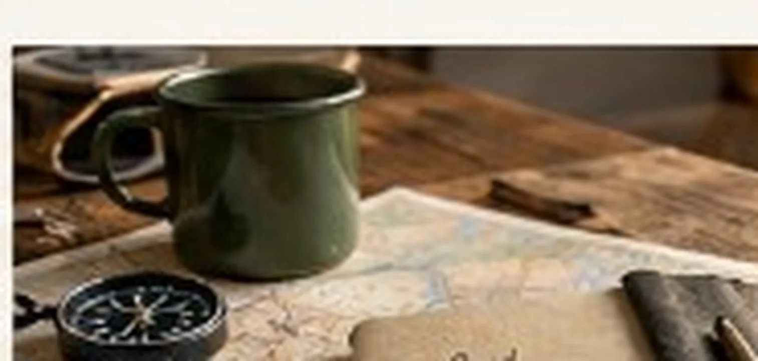 Notebook, compass, and map flat-lay on a wooden table